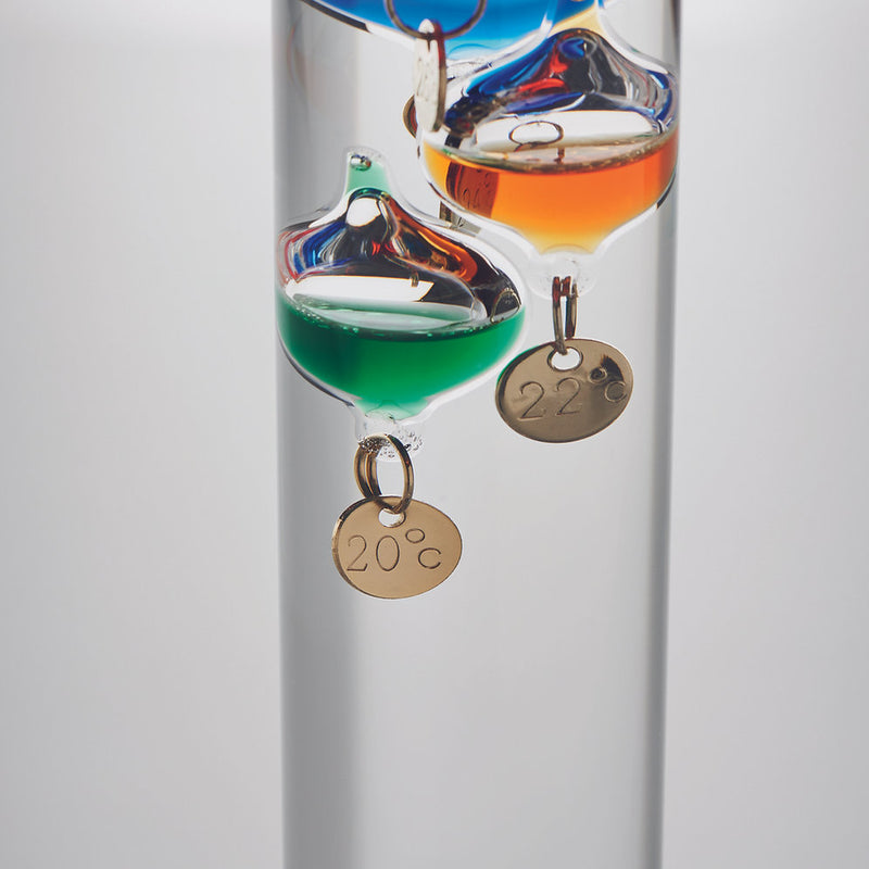 Galileo thermometer in glass